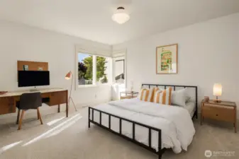 Tucked quietly at the end of the main-floor, this oversized bedroom features a double closet, and windows looking out upon the park-like backyard.
