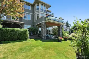 The beautifully landscaped backyard is an entertainer’s dream with covered patio area, built-in gas fire pit, hot tub, ideal for outdoor use throughout the year!