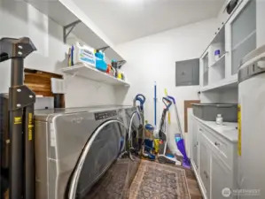 Laundry room with good storage space.
