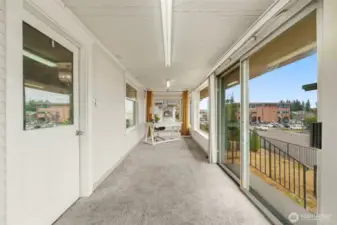Finished, heated front porch for a street side walk up office or a space to extend your gatherings out.
