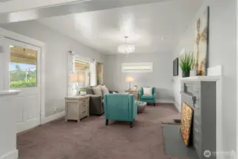 Wood burning fireplace in living room.