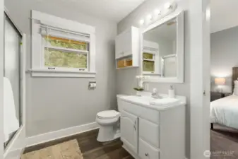 Main level full bath is a connector between the bedrooms.
