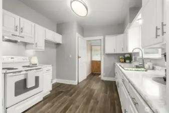 Enclosed back porch entrance to galley kitchen.