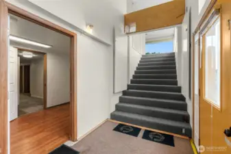 Wide open staircase to upper level.