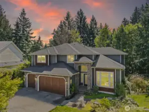 Front of home with 3 car garage
