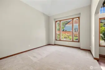 Formal living room with view of front koi pond