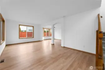 Open concept living/dining area with lots of natural light/windows.