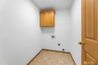 Laundry Room w/ cabinetry.