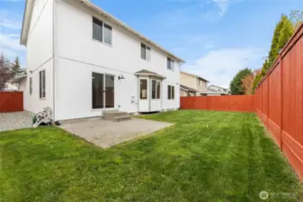 Large backyard with patio.
