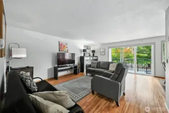 Enter into main living space.  It is bright and welcoming.  Sliding door leads to private balcony.