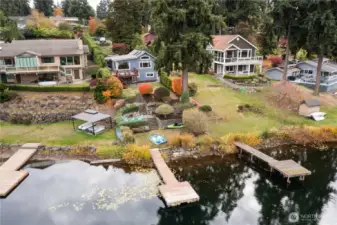 Wonderfully landscaped lake front lot with a private dock.