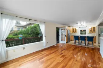 The door on the left leads out out to the front of the house or onto the wrap-around deck that will lead you to the water.