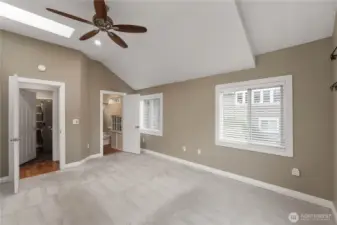 On the right side down the little hallway you'll find the large master with vaulted. ceilings