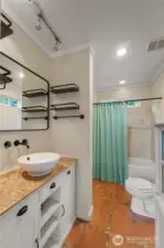 Charming cabin themed master bathroom.  Custom tilework throughout.