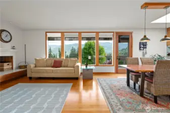 The open concept living room, with gorgeous windows and majestic 8' tall glass doors, displays the panoramic view!