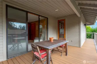Fabulous new composite deck with a cable railing to emphasize the views! Slider leads to the bedroom/office on the main floor. The glass door opens to the kitchen.