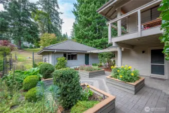 This charming sunny patio also has a fenced in area, at the back of the garage for further gardening adventures!