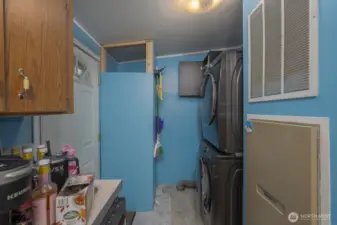 Laundry area + additional back entry towards garage/shop (Washer/Dryer not included)