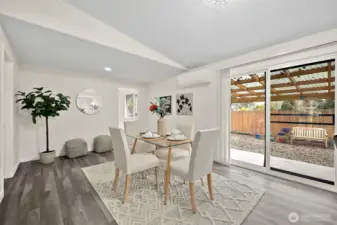 Dining room with access to backyard patio for entertaining and BBQ dinners. Utility room right off dining room.