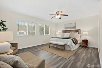 Step into the spacious primary bedroom to unwind from the day and snooze away. 2 large windows bringing in western light. Room features ceiling fan and brand new flooring, en-suite full bathroom and walk-in closet.