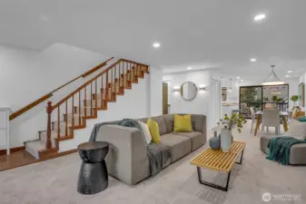 Grand staircase leads you to the upper 2 bedrooms. The living room and dining room flow seamlessly with each other right in to the beautfil kitchen with breakfast bar.  New can lighting, wall sconces and overhead dining room lighting.