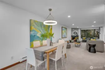 The dining room is central to the living room and kitchen. Closet can be used for coats and other items. There is a powder room left of the mirror that makes it convenient for you and your guests.