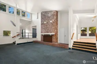 Light filled living room with wood fireplace