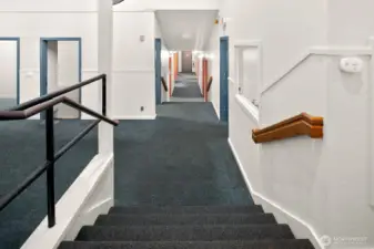 Stairs to mid-level gathering rooms.