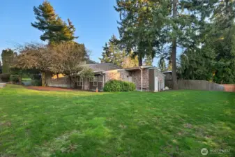 Looking east from the level backyard towards the primary building.