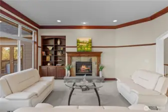 Back inside, we see the warmth of a second fireplace