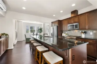 Open kitchen with massive island that can accommodate seating for 5.