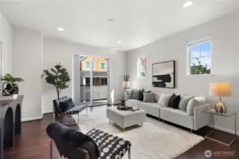 Relax or entertain in the light-filled living area of this end unit.