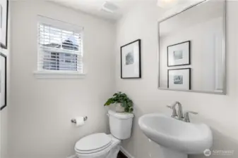 A guest powder room completes the main floor.