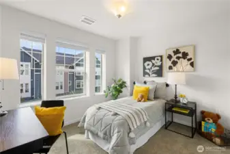 Second upstairs bedroom, also with lots of light.