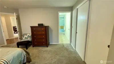 Primary bedroom shows entry to large, tastefully updated primary bath!