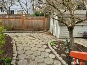 Standing on the spaciuse deck looking at on of the many concrete paver walkways!
