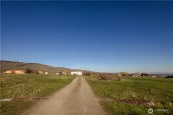 Welcoming gravel drive with plenty of space and seclusion.