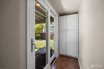 Sliding door provides a second access point to the backyard and patio, creating a circular layout and including the back outdoor space as a valued and utilized part of the home