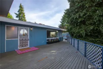 The deck that leads up to the front entrance has a peak-a-boo view of the water that improves when the trees are bare.