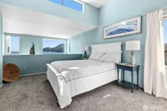 This is the upper level, large, primary suite. Light and bright with tranquil views.