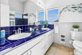 Dual sinks in the primary suite. A full bath with a view!