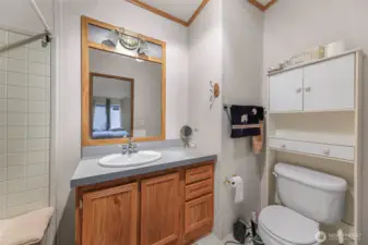 The en-suite bathroom includes an oak vanity, ample lighting, and generous counter space—designed with ease and functionality in mind for 55+ living. Tucked inside Lake Samish Terrace, it’s part of a home designed for low-maintenance comfort.