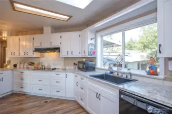 Expansive window invites sunlight to pour in, brightening the space.