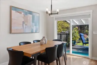 The sliding door (installed in 2019) joins the indoor and outdoor dining areas!