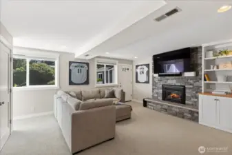 The lower-level family room/rec room is a great place to hang out!