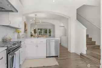 Updated kitchen with quartz countertops and stainless steel appliances.