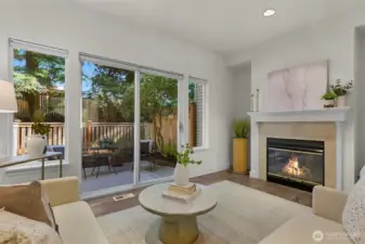 The living area offers views of a private, fully fenced patio—perfect for relaxing or entertaining.