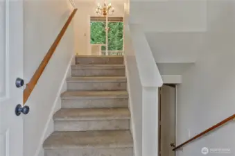 Step inside and you’re greeted by a classic split-level entry, offering an inviting flow that leads you upstairs to the bright and open main living area or downstairs to the spacious daylight basement.
