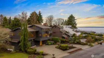 Set in the peaceful Seacrest enclave of Broadview, this exceptional home rises above the street to take full advantage of its high Puget Sound view. Positioned on a quiet cul de sac just steps from the shoreline, the residence offers a rare combination of serenity, privacy, and elevated outlooks that define this treasured corner of Seattle.