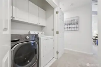 Full Washer and Dryer with shelves.  New laminate tiled floor.
